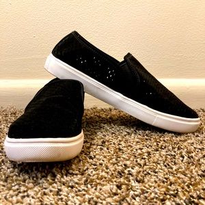 Black and white slip ons